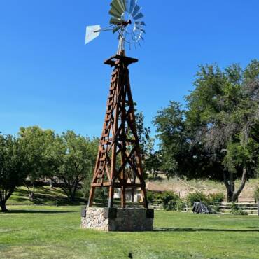 10-foot Aermotor windmill over a hand-dug rock-lined well in Peeples Valley, Arizona, by Big Sky Windmills.